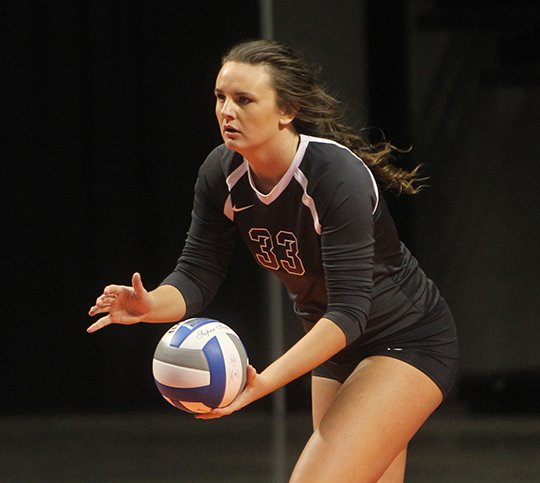 The Sentinel-Record/Richard Rasmussen STANDOUT SERVICE: Ouachita Baptist senior Kori Bullard prepares to serve in the final match of her career with the Tigers a week ago in the first round of the 2017 Great American Conference Volleyball Championship Tournament at Bank of the Ozarks Arena. The Lake Hamilton graduate now turns her attention to her final basketball season.