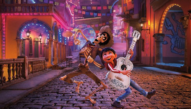 Aspiring musician Miguel (voice of Anthony Gonzalez) teams up with the skeleton Hector (Gael Garcia Bernal) to sort out a family mystery in the Land of the Dead in Pixar’s Coco.
