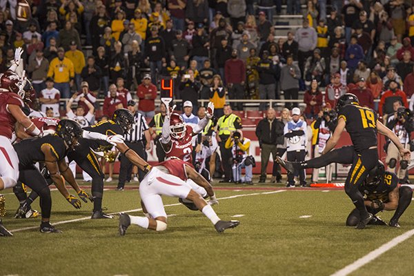 Missouri kicker Tucker McCann (19) kicks a 19-yard field goal with 5 seconds remaining to give the Tigers a 48-45 win over Arkansas on Friday, Nov. 24, 2017, in Fayetteville. 
