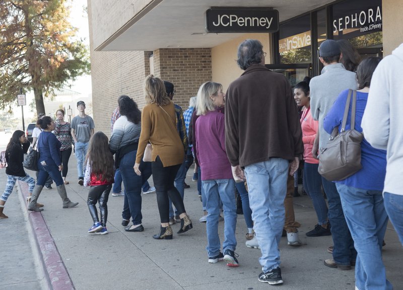 Shoppers are wrap around the building as JC Penney and Sephora at Broadway Square Mall in Tyler, Texas open their doors on Thanksgiving Day Thursday, Nov. 23, 2017. (Sarah A. Miller/Tyler Morning Telegraph via AP)