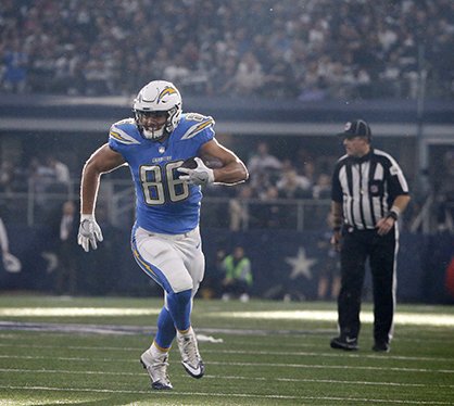 The Associated Press ROOM TO RUN: Los Angeles Chargers' tight end Hunter Henry (Pulaski Academy, University of Arkansas) gains long yardage after catching a pass in the first half of an NFL football game against the Dallas Cowboys on Thursday in Arlington, Texas. Henry had five catches for 76 yards and a touchdown in the Chargers' 28-6 win.