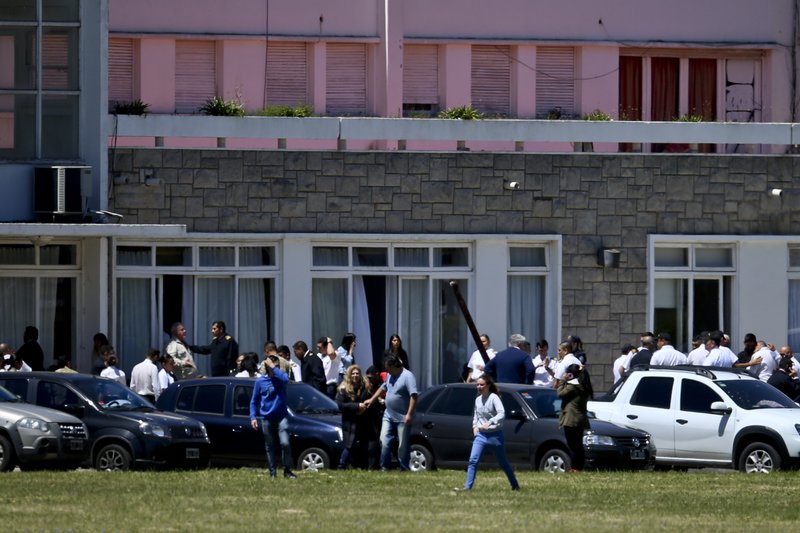 The Associated Press SUBMARINE: Relatives of ARA San Juan submarine crew members are seen at the Mar de Plata Naval Base after they were told a sound detected during the search for the missing submarine is consistent with that of an explosion Thursday in Mar de Plata, Argentina. A Navy spokesman said that the search will continue until there is full certainty about the fate of the missing submarine. He said there was no sign the explosion might be linked to any attack on the sub.