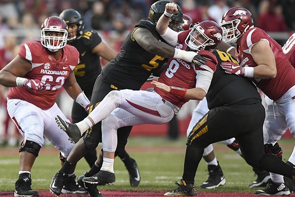 Missouri defensive lineman Terry Beckner Jr. (5) tackles Arkansas quarterback Austin Allen (8) in the second half during a football game on Friday, Nov. 24, 2017 at Razorback Stadium in Fayetteville.
