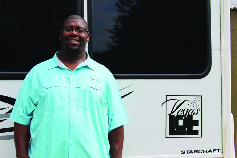 Party Bus: Electrical engineer Merari Davis shows off his party bus project with a logo for The Vegas Lot, a rental space near the West Hillsboro-North West intersection. Brittany Williams/News-Times