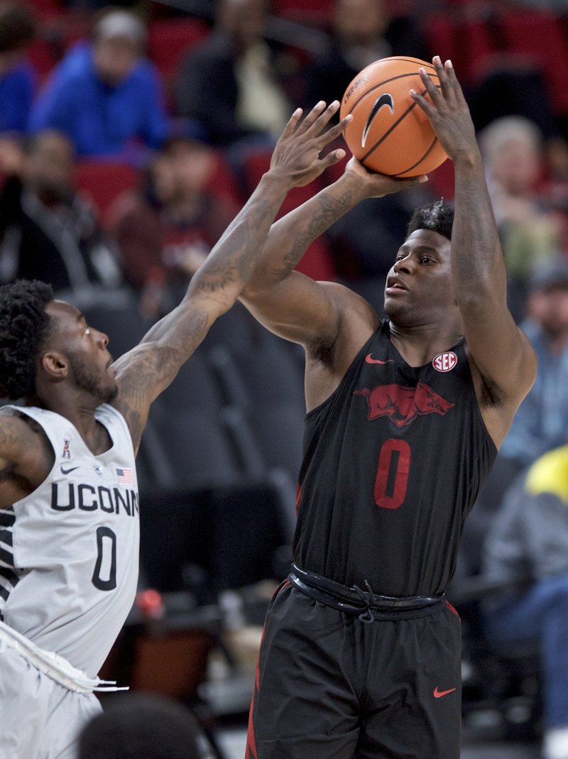 The Associated Press BARFORD'S HOT HAND: Arkansas guard Jaylen Barford, right, shoots over Connecticut guard Antwoine Anderson during the second half of an NCAA basketball game in the Phil Knight Invitational tournament in Portland, Ore., Sunday. Barford led Arkansas with 24 as the Razorbacks rolled over the Huskies, 102-67.