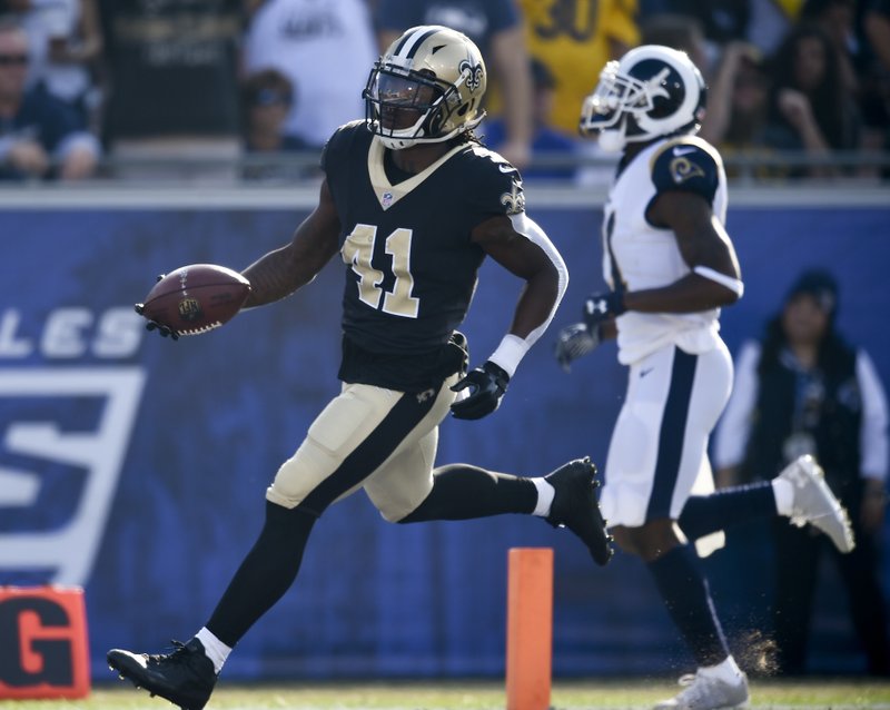 The Associated Press BIG RUN ROOKIE: New Orleans Saints running back Alvin Kamara runs for a 74-yard touchdown against the Los Angeles Rams during the first half of an NFL game Sunday in Los Angeles. Kamara finished with six carried for 101 yards.