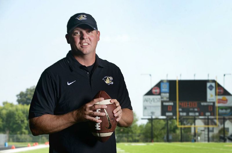 Jody Grant, Bentonville head football coach, poses for a photo on Saturday Aug. 22, 2015 during Tiger Pride night in Bentonville's Tiger Stadium. 
