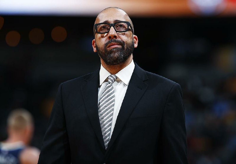 In this Nov. 24, 2017, file photo, Memphis Grizzlies head coach David Fizdale reacts as he calls a timeout while facing the Denver Nuggets in the first half of an NBA basketball game in Denver. The Grizzlies have fired Fizdale, with the team at 7-12 and a day after he benched center Marc Gasol for the fourth quarter of an eighth straight loss. General manager Chris Wallace announced the move Monday, Nov. 27, 2017. 