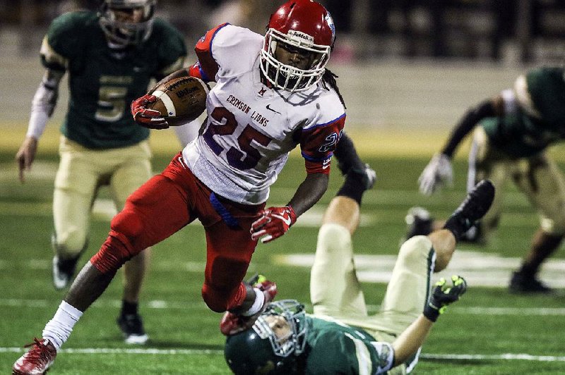 Little Rock McClellan’s Tyrse Lair (25) has started at quarterback and cornerback in helping the Crimson Lions reach the Class 5A state championship game against Pulaski Academy. 