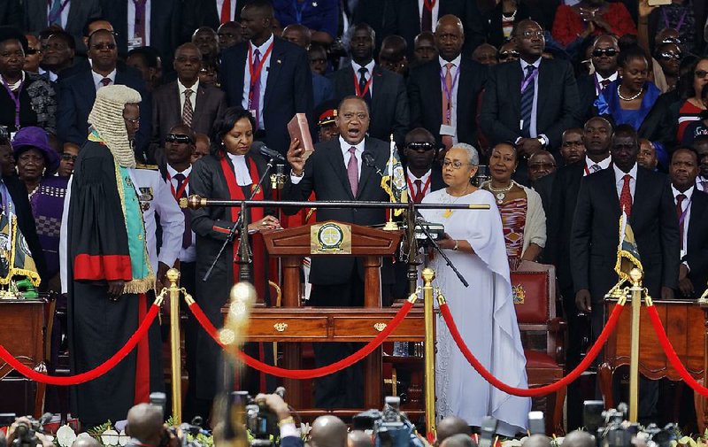 Kenyan President Uhuru Kenyatta (center) takes the oath of office Tuesday at Kasarani Stadium in Nairobi. 