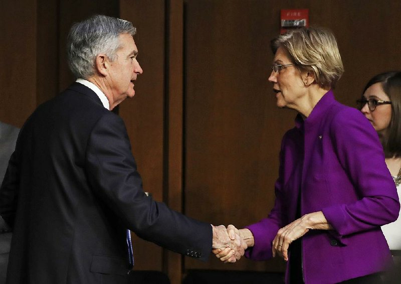 Sen. Elizabeth Warren, D.-Mass., greets Jerome Powell, President Donald Trump’s nominee for chairman of the Federal Reserve Board, before he testifies at a committee confirmation hearing Tuesday. 