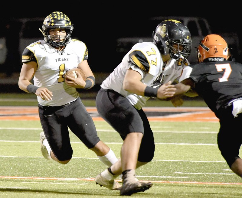 Shelley Williams Special to the Enterprise-Leader Prairie Grove senior halfback Anthony Johnson looks for running room behind the block of sophomore Hayden Black. The Tigers were defeated in the 4A State quarterfinals, 35-13, at No. 1 Warren Friday. They end their season with an 11-2 record.