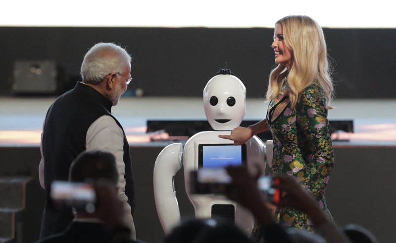 The Associated Press ROBOT BUTTON: Indian Prime Minister Narendra Modi, left watches as U.S. presidential adviser and daughter Ivanka Trump presses the button on a robot during the opening of the Global Entrepreneurship Summit Tuesday in Hyderabad, India.