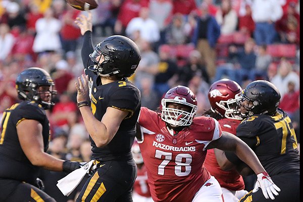 Arkansas defensive lineman Bijhon Jackson (78) rushes Missouri quarterback Drew Lock (3) during a game Friday, Nov. 24, 2017, in Fayetteville. 