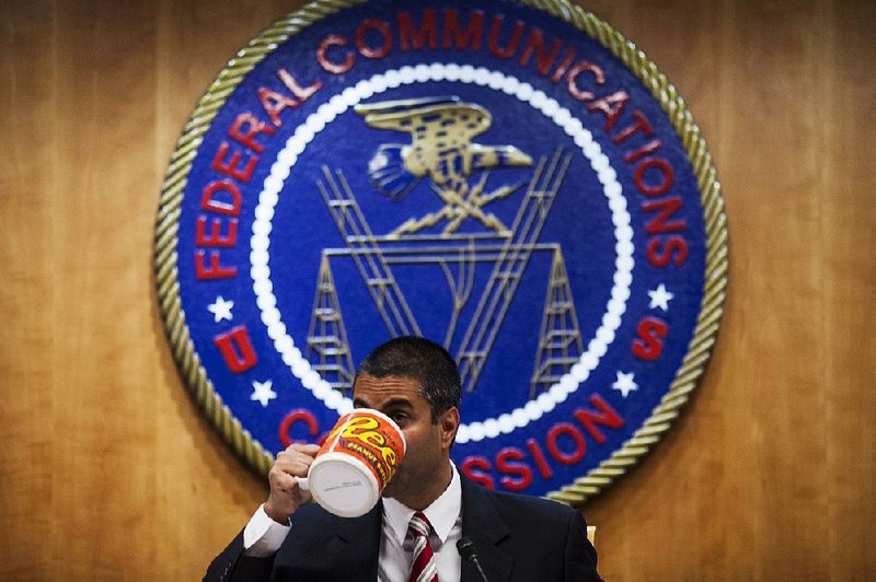 Federal Communications Commission Chairman Ajit Pai attends a meeting in Washington earlier this month. A vote on his plan to end Internet neutrality rules is set for December. 