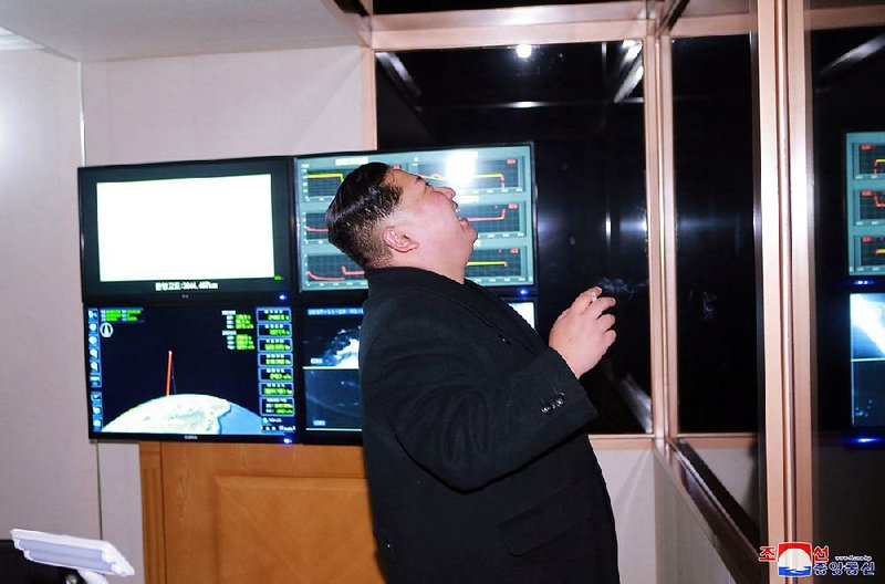 North Korean leader Kim Jong Un watches an intercontinental ballistic missile test at an undisclosed site Wednesday, according to the North Korean government, which distributed this image. 