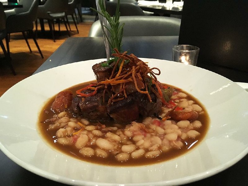 The Thyme Braised Veal Osso Bucco rises out of a cannellini bean ragu. 