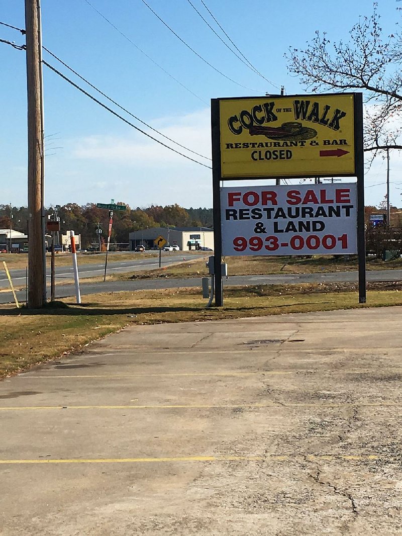 The sign on Maumelle Boulevard pointing the direction toward Cock of the Walk says “closed,” and a large banner proclaims the restaurant and the land is now for sale. 