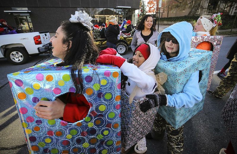 A Girl Scout troop lines up for last year’s Big Jingle Jubilee Holiday Parade. This year’s parade through downtown Little Rock with floats, bands and even animals is set for Saturday. 