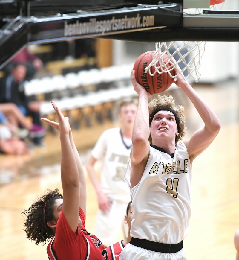 NWA Democrat-Gazette/J.T. WAMPLER Bentonville High's Asa Hutchinson (4) goes up for a shot against Clarksville on Wednesday at the Crabtree Invitational basketball tournament in Bentonville.