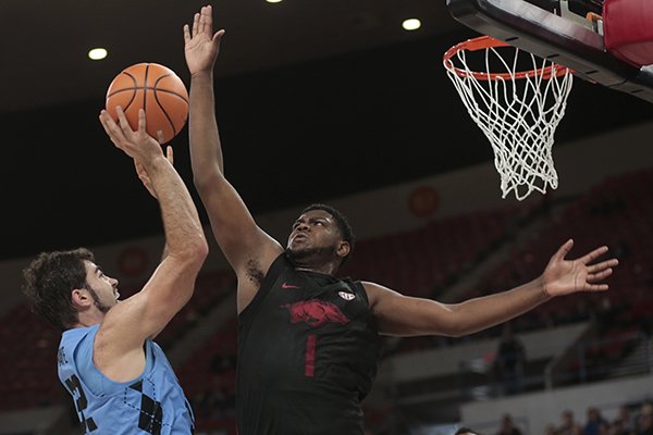 North Carolina's Luke Maye (32) gets a shot off past Arkansas' Trey Thompson in the first half of an NCAA college basketball game during the Phil Knight Invitational tournament in Portland, Ore., Friday, Nov. 24, 2017. (AP Photo/Timothy J. Gonzalez)

