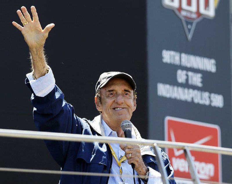 Jim Nabors waves to the crowd before singing at the 98th running of the Indianapolis 500 in May 2014. 