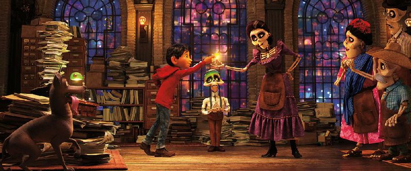 Anthony Gonzalez provides the voice of aspiring musician Miguel, who finds himself stuck in the Land of the Dead in Disney Pixar’s Coco. Gabriel Iglesias provides the voice of the clerk (middle) and Alanna Ubach as the voice of Miguel’s grandmother, Mama Imelda. The film came in first at last weekend’s box office and made about $73 million. 
