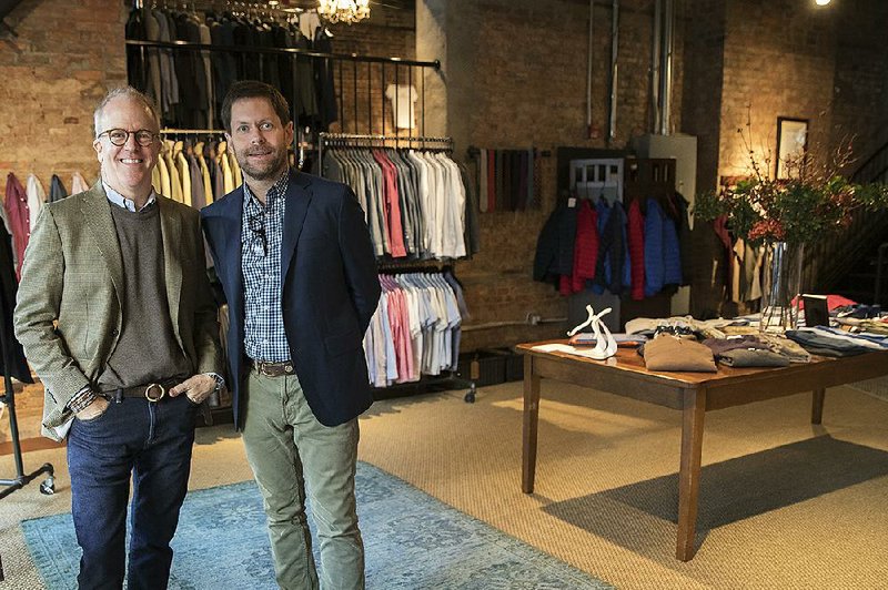 Designer Peter Manning, left, and Jeff Hansen, CEO of Peter Manning, pose for a photo in the Peter Manning showroom in New York, last month. The retailer doesn’t do huge markdowns to attract customers. 