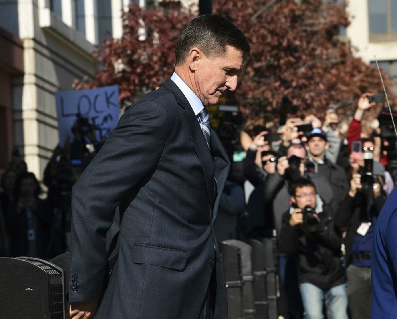 Michael Flynn leaves federal court Friday in Washington after his guilty plea. Prosecutors said they would delay Flynn’s sentencing, a sign that the investigation was not over. 