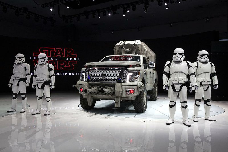 Stormtroopers promoting the Star Wars film franchise stand beside a Nissan Titan concept vehicle Thursday at the Los Angeles Auto Show. 