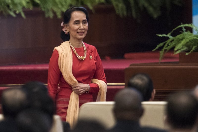 Myanmar's civilian leader Aung San Suu Kyi arrives to give a speech at the Great Hall of the People in Beijing, Friday, Dec. 1, 2017. (Fred Dufour/Pool Photo via AP)