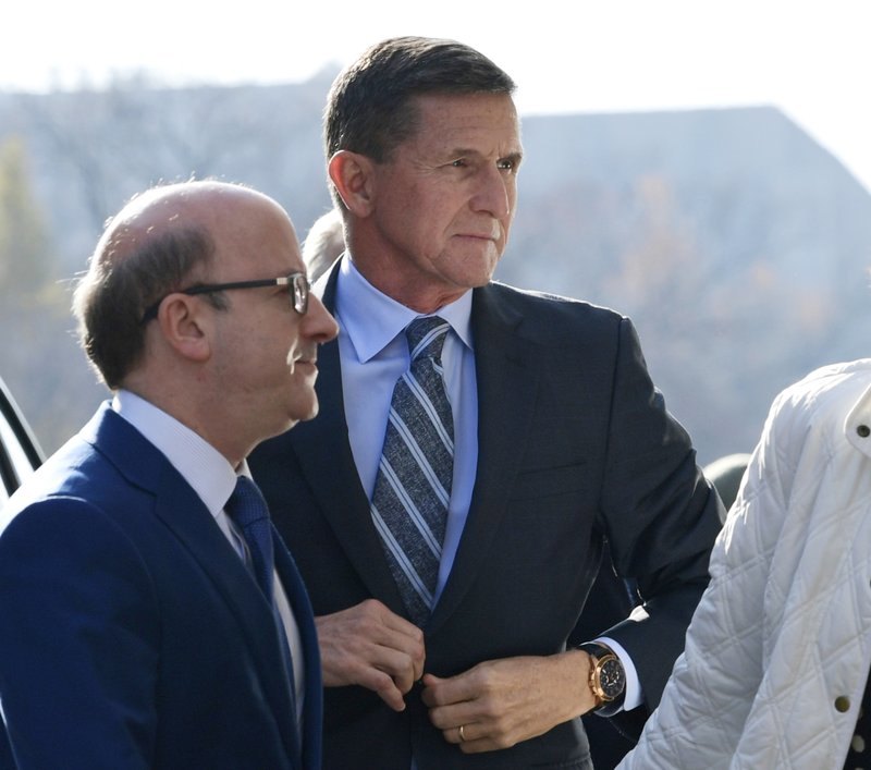 Former Trump national security adviser Michael Flynn arrives at federal court in Washington, Friday, Dec. 1, 2017. Court documents show Flynn, an early and vocal supporter on the campaign trail of President Donald Trump whose business dealings and foreign interactions made him a central focus of Mueller's investigation, will admit to lying about his conversations with Russia's ambassador to the United States during the transition period before Trump's inauguration. (AP Photo/Susan Walsh)
