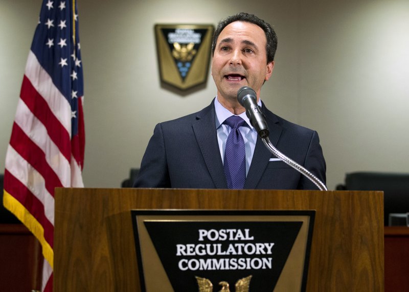 Postal Regulatory Commission Chairman Robert Taub speaks during a news conference in Washington, Friday, Dec. 1, 2017. Federal regulators are moving to give the U.S. Postal Service more freedom to raise stamp costs beyond the rate of inflation. The commission's proposal would allow the beleaguered Postal Service to increase the price of a first-class stamp by an additional 2 percent above the rate of inflation to avoid bankruptcy and improve mail and package delivery. ( AP Photo/Jose Luis Magana)