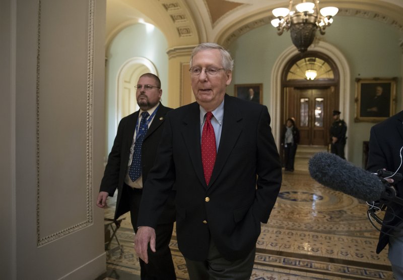 Senate Majority Leader Mitch McConnell, R-Ky., walks from the chamber to his office as the GOP overhaul of the tax bill nears a vote, on Capitol Hill in Washington, Friday, Dec. 1, 2017. (AP Photo/J. Scott Applewhite)