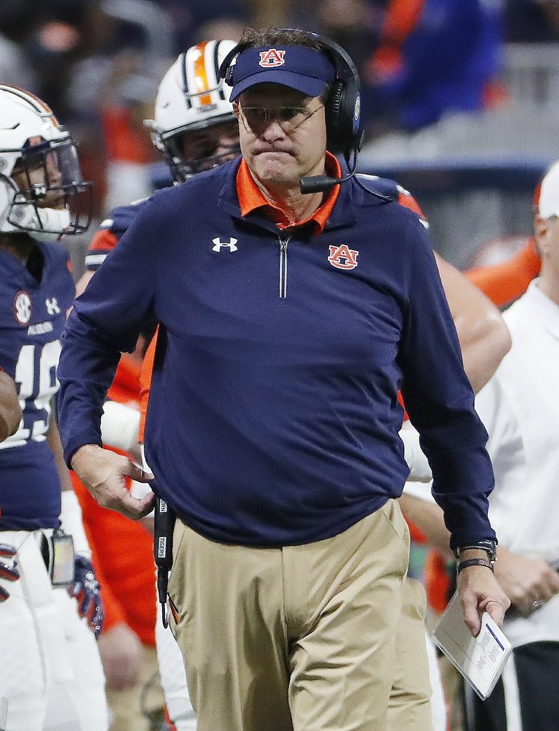 Auburn head coach Gus Malzahn walks the turf during the first half of the Southeastern Conference championship NCAA college football game against Georgia, Saturday, Dec. 2, 2017, in Atlanta. (AP Photo/David Goldman)
