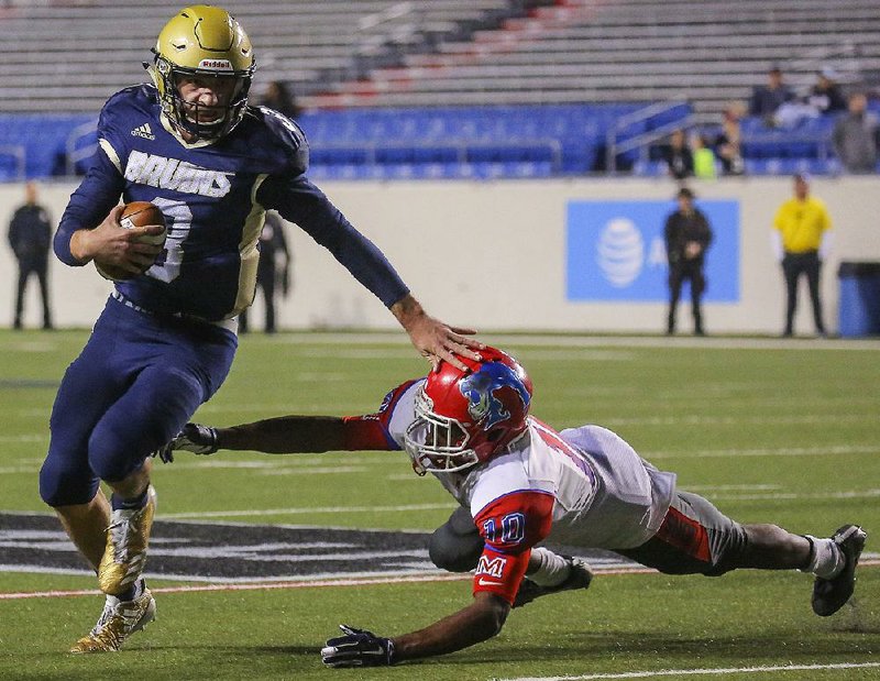 FILE — Pulaski Academy quarterback Layne Hatcher runs by McClellan defender Damion Martin to score the game winning touchdown late in the fourth quarter of their 37-36 victory over McClellan in the Class 5A High School Football State Finals on Dec. 2, 2017, at War Memorial Stadium.
