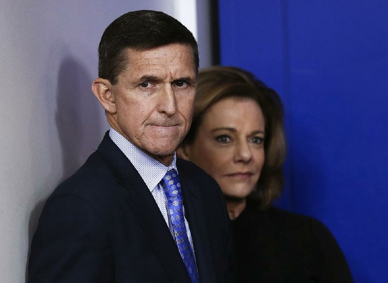 Michael Flynn and K.T. McFarland watch from the wings at a daily White House briefing Feb. 1, while he was still national security adviser and she was his deputy.