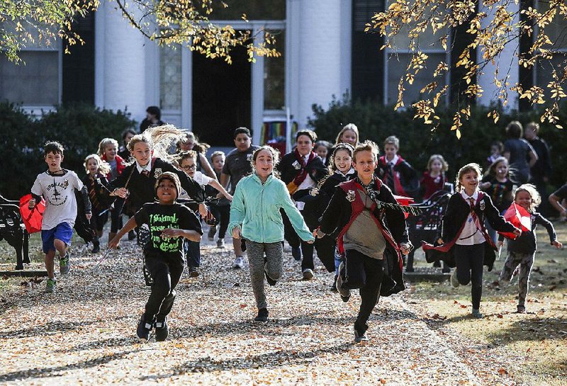 Arkansas Democrat-Gazette/MITCHELL PE MASILUN --12/2/2017--
Kids start a Horcrux Hunt on the grounds of the Terry House during the Arkansas Arts Center's Harry Potter Holiday Wonderland event in Little Rock Saturday, December 2, 2017.