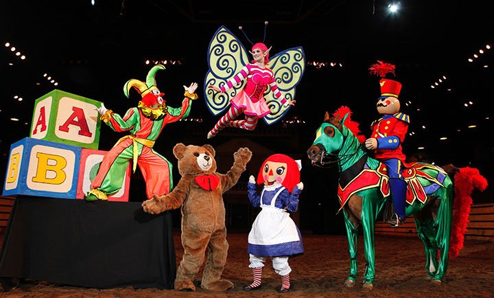 Performer Lezlie Young soars above the toys in a Nutcracker scene during Christmas at Dixie Stampede in Branson.
