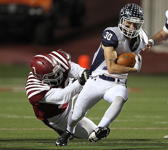 Arkansas Democrat-Gazette/THOMAS METTHE -- 12/1/2017--
Greenwood running back Kenny Wood (30) shakes off Pine Bluff defensive end Kylen Williams (7) for a 73-yard touchdown during the first quarter of the Class 6A state championship game on Friday, Dec. 1, 2017, at War Memorial Stadium in Little Rock. 