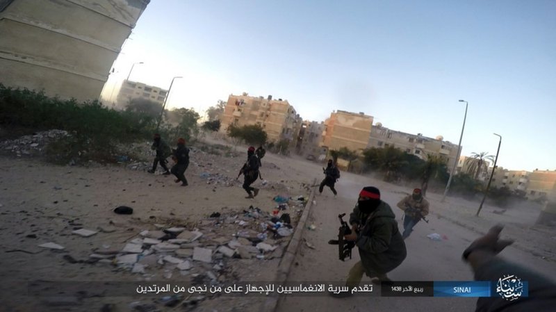 FILE - This photo posted on a file sharing website Wednesday, Jan. 11, 2017, by the Islamic State Group in Sinai, a militant organization, shows a deadly attack by militants on an Egyptian police checkpoint, in el-Arish, north Sinai, Egypt. The Egypt mosque massacre could point to the rise of an ultra-extremist faction that is so radical in its readiness to kill fellow Muslims that it has caused rifts within the Islamic State group _ already notorious for its atrocities. (Islamic State Group in Sinai via AP, File )