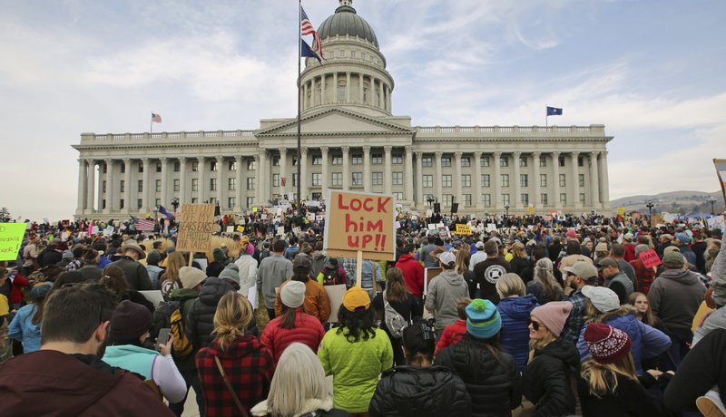 Supporters of the Bears Ears and Grand Staircase-Escalante National Monuments gather during a rally Saturday, Dec. 2, 2017, in Salt Lake City. President Donald Trump is expected to announce plans to shrink the two sprawling national monuments in Utah that were created by past Democratic presidents. (AP Photo/Rick Bowmer)