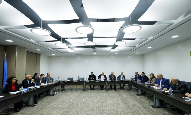 Members of the delegation of the Syrian Negotiation Commission (SNC) attend a meeting with United Nations Deputy Special Envoy for Syria Ramzy Ezzeldin Ramzy during the Intra Syria talks in Geneva, Switzerland, Friday, Dec. 1, 2017. 