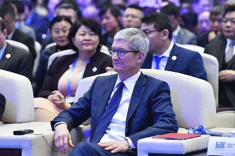 Apple CEO Tim Cook attends the opening ceremony of the World Internet Conference in Wuzhen town in Tongxiang, East China’s Zhejiang province, on Sunday.