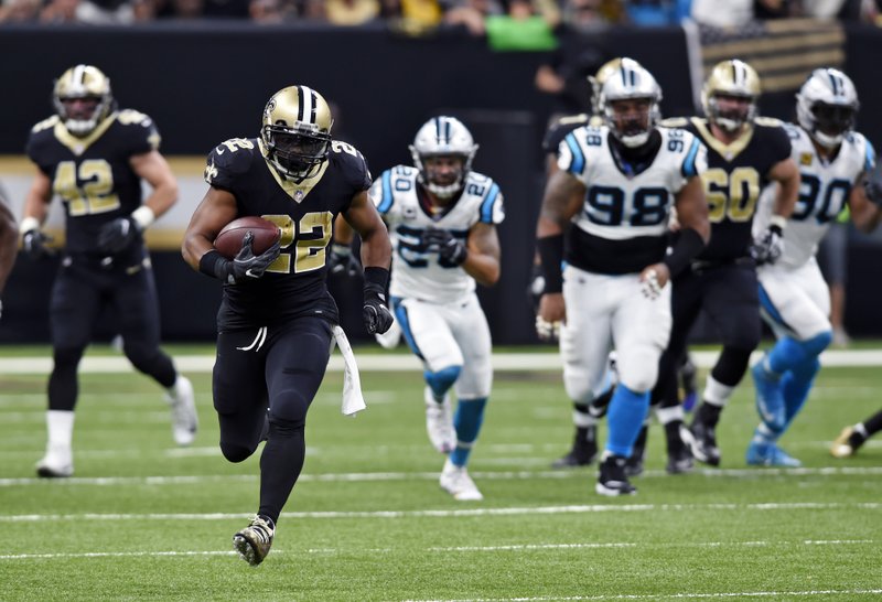 The Associated Press LEADING THE CHASE: New Orleans Saints running back Mark Ingram (22) carries on a 72-yard run in the first half of an NFL game against the Carolina Panthers in New Orleans Sunday. Ingram finished with 85 yards rushing and a touchdown in the Saints' 31-21 win.