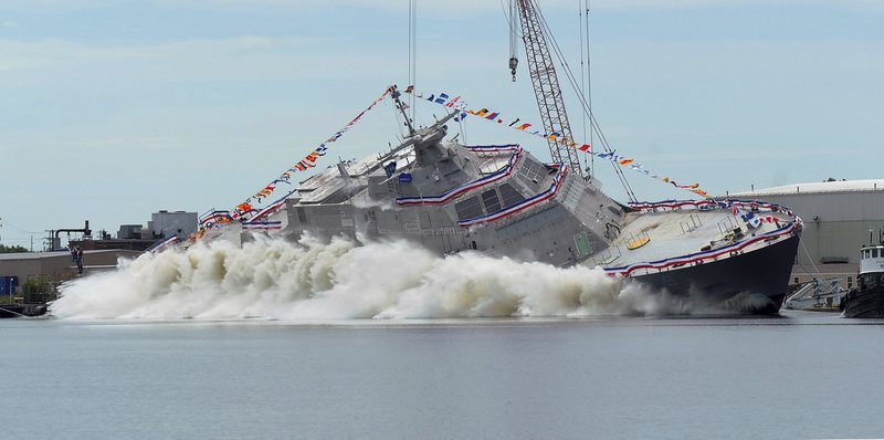 FILE - In this July 18, 2015, file photo, the USS Little Rock littoral combat ship is launched into the Menominee River at Marinette, Wis. The USS Little Rock is expected to arrive at Buffalo&#x2019;s Lake Erie waterfront on Monday, Dec. 4, 2017. It will be commissioned Dec. 16 at the Buffalo and Erie County Naval and Military Park, where three World War II vessels are docked. (Rick Gebhard/The Eagle Herald via AP, File)