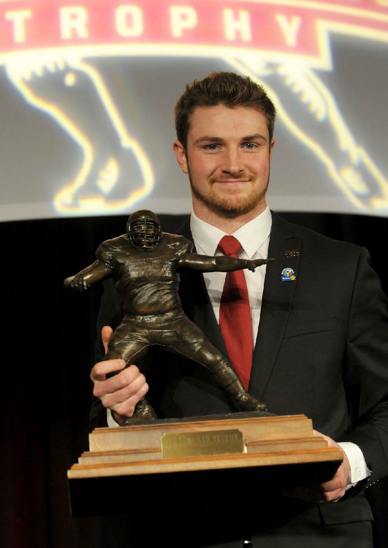 Luke Falk, quarterback for Washington State University, received the 2017 Burlsworth Trophy on Monday at the Northwest Arkansas Convention Center in Springdale. The award is named after Brandon Burlsworth, a former walk-on for the Arkansas Razorbacks.