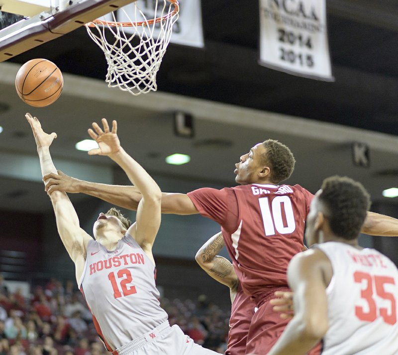 The Associated Press DEFENSIVE FAIL: Arkansas' Daniel Gafford (10) fouls Houston's Wes Vanbeck (12) during the first half of an NCAA basketball game Saturday in Houston. Arkansas head coach Mike Anderson bemoaned his team's lack of defensive effort in Saturday's 91-65 loss in Houston.