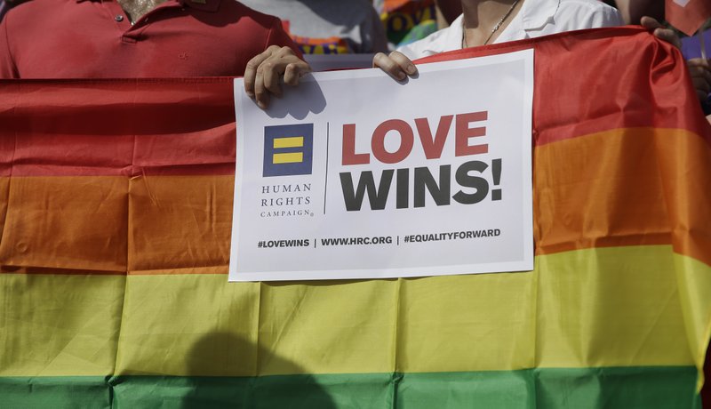 In this June 29, 2015, file photo, Supporters of the U.S. Supreme Courts ruling on same-sex marriage gather on the step of the Texas Capitol for a news conference celebrating marriage equality and looking to important work ahead in Austin, Texas.