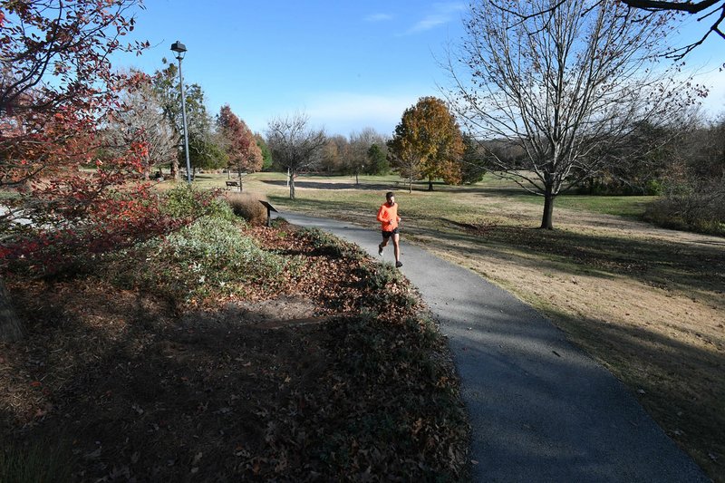 A jogger uses the trail at Gulley Park on Nov. 21.